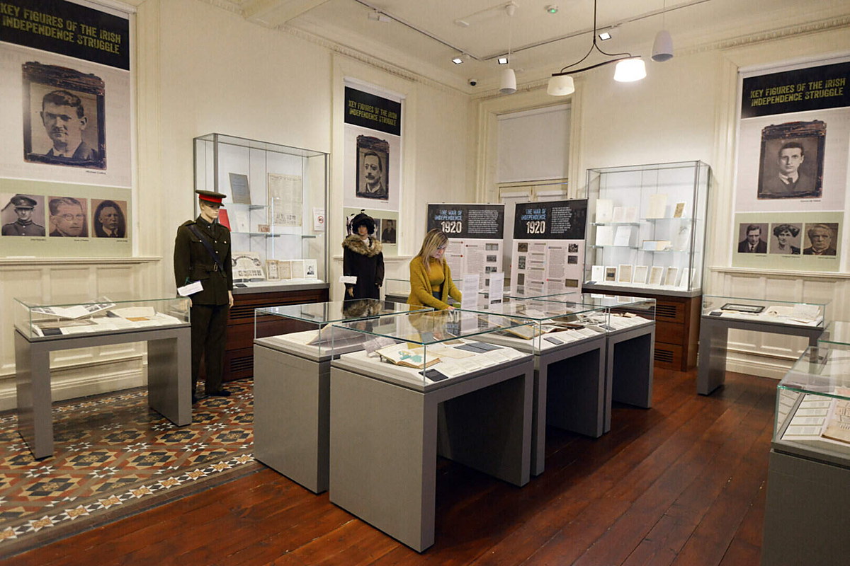 Visitor browsing display cases of Irish memorabilia at the Jackie Clarke Collection, Ballina, Co Mayo